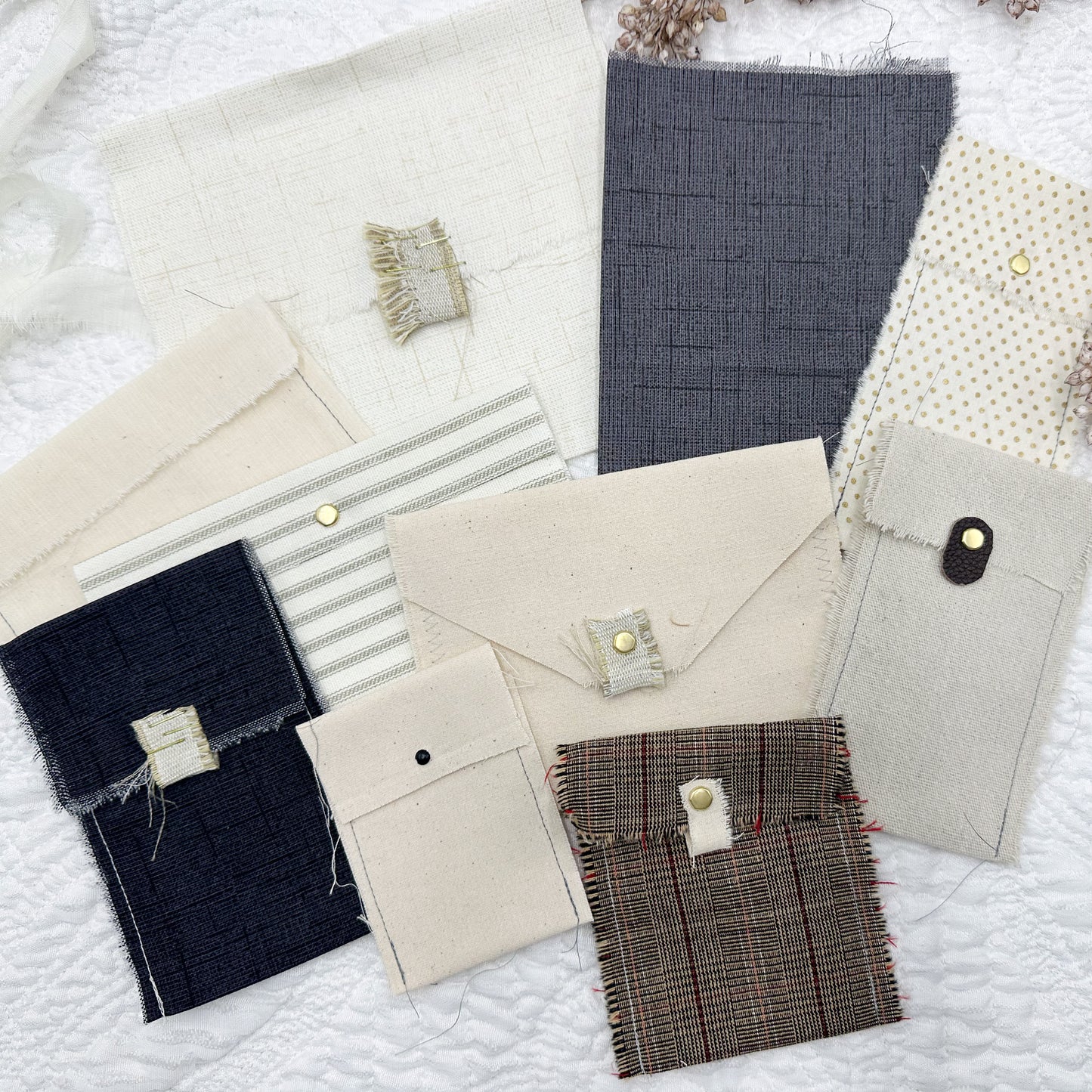 Rough Sewn Fabric Pockets and Signature Pages in Neutral Colors