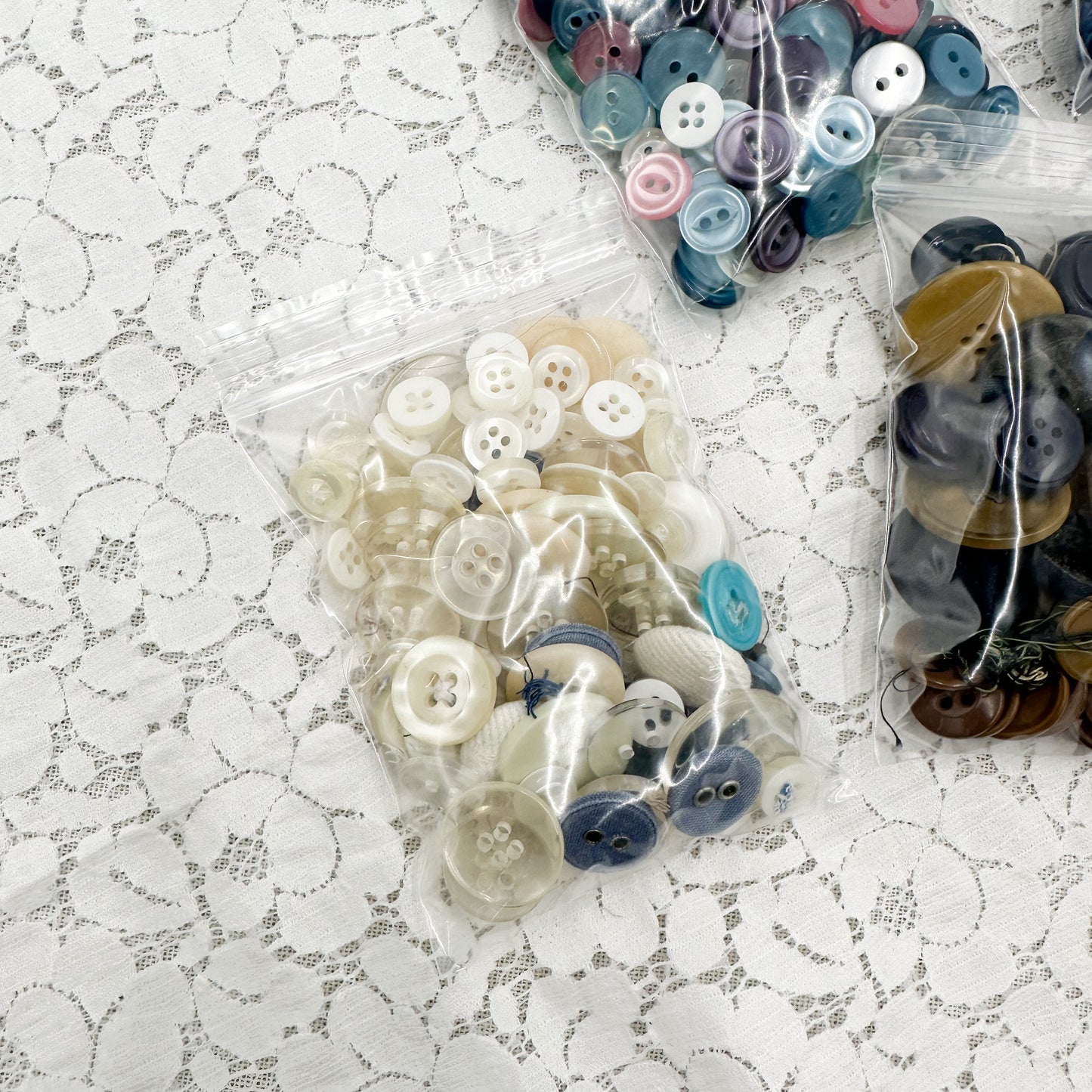 Bags of Blue and Neutral Buttons